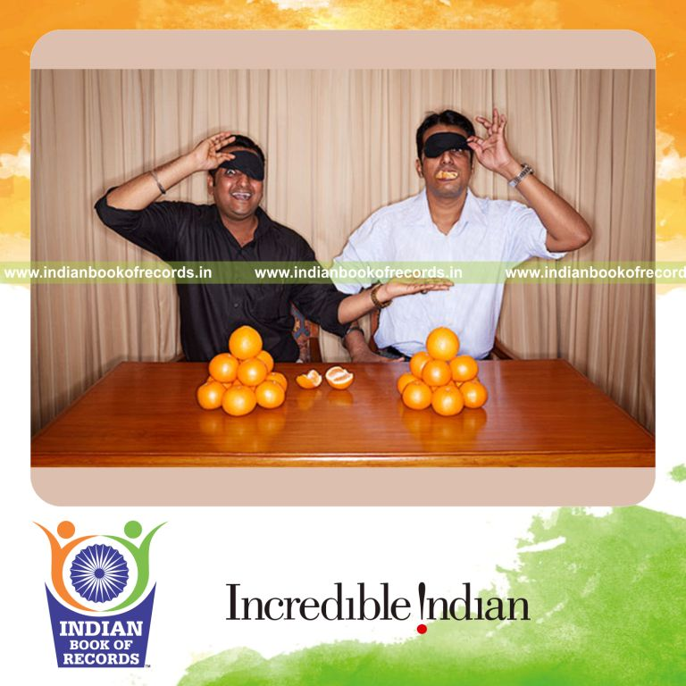team peeling and eating orange blindfolded in fastest time for Indian Book of Records