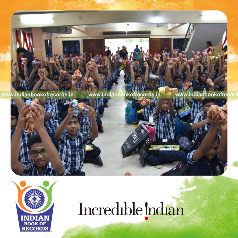 Large group creating origami balls simultaneously at a single venue recognized by the Indian Book of Records
