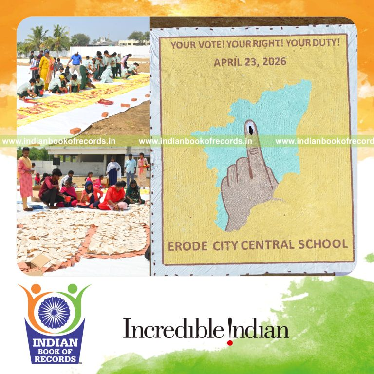Team assembling a giant origami heart mosaic, recognized by Indian Book of Records.