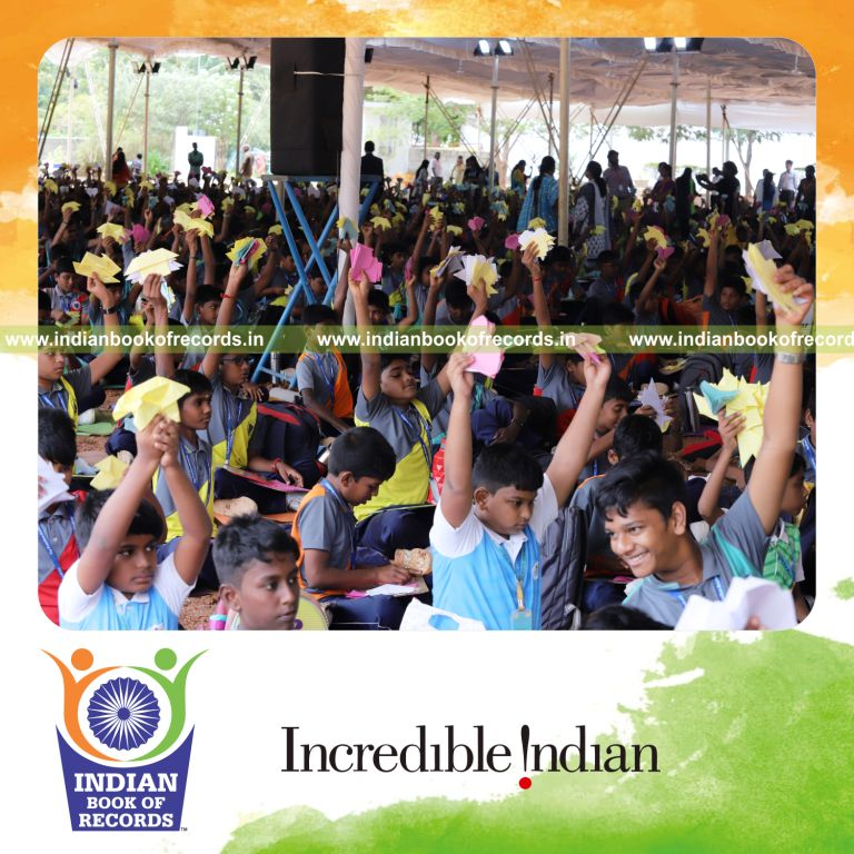 Large group folding paper into origami models simultaneously at a single venue for Indian Book of Records