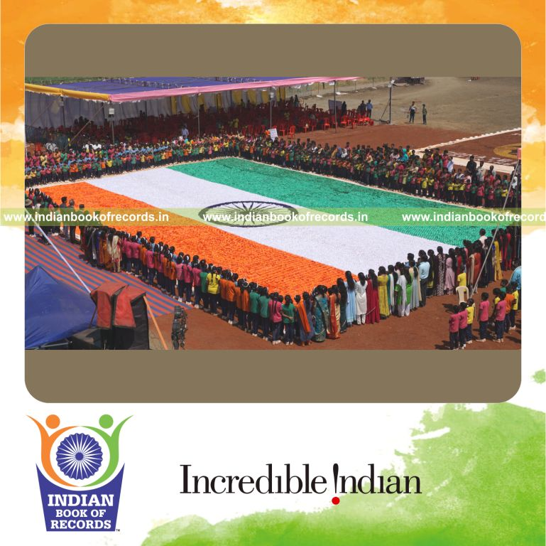 A large national flag created using origami models displayed for the Indian Book of Records