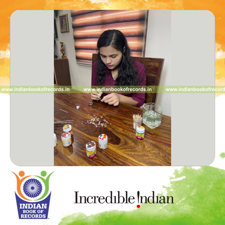 Intricate patriotic artworks carefully created on a single rice grain recognized by Indian Book of Records
