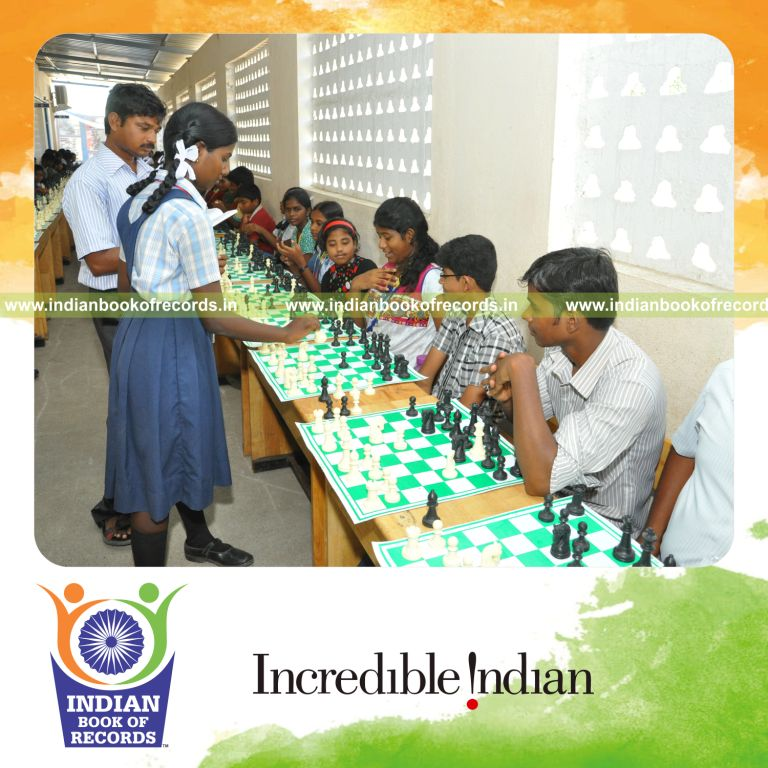 young female playing chess simultaneously with multiple opponents for record in Indian Book of Records