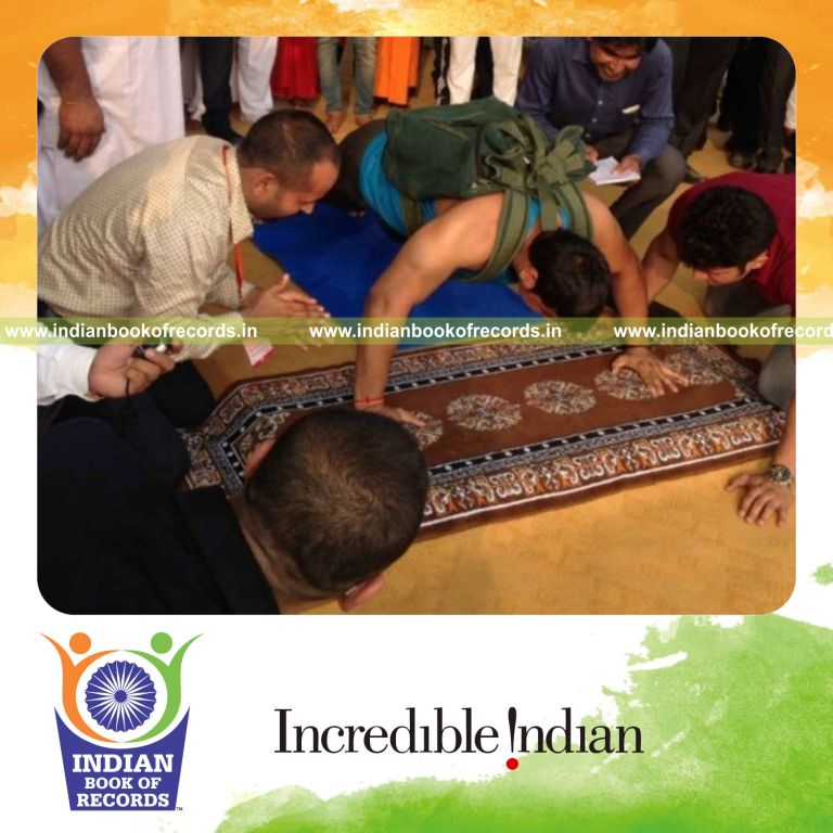 maximum push ups performed carrying weight pack for Indian Book of Records
