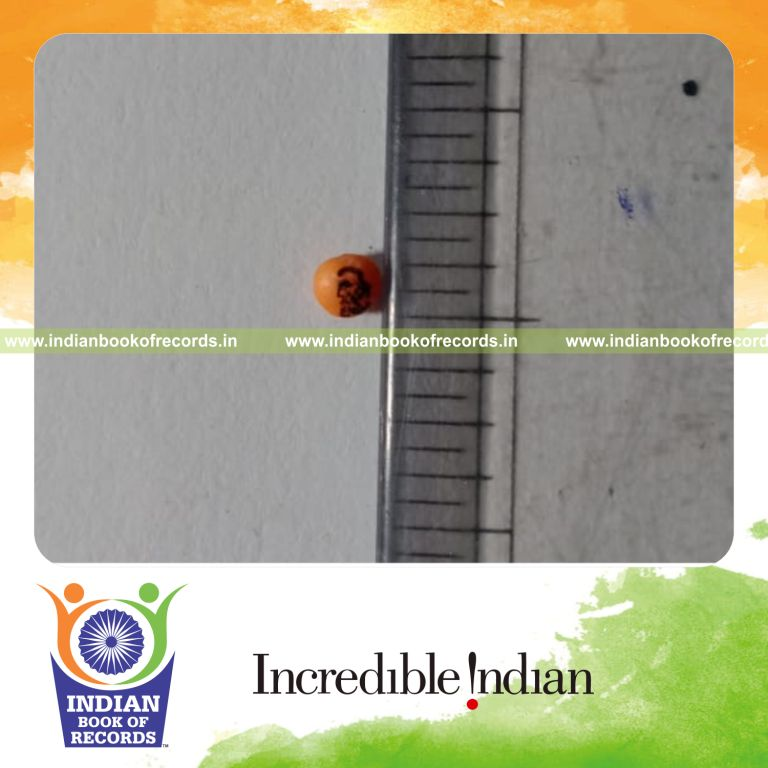 Tiny portrait of Rabindranath Tagore painted quickly on a red lentil seed recognized by Indian Book of Records
