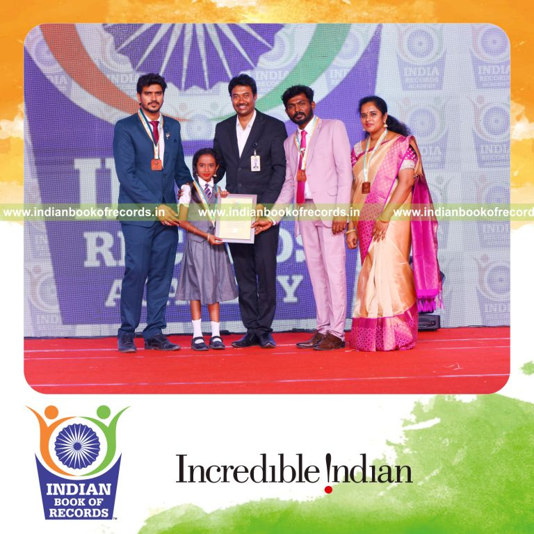 Individual reviewing multiple books quickly within a short time frame for Indian Book of Records