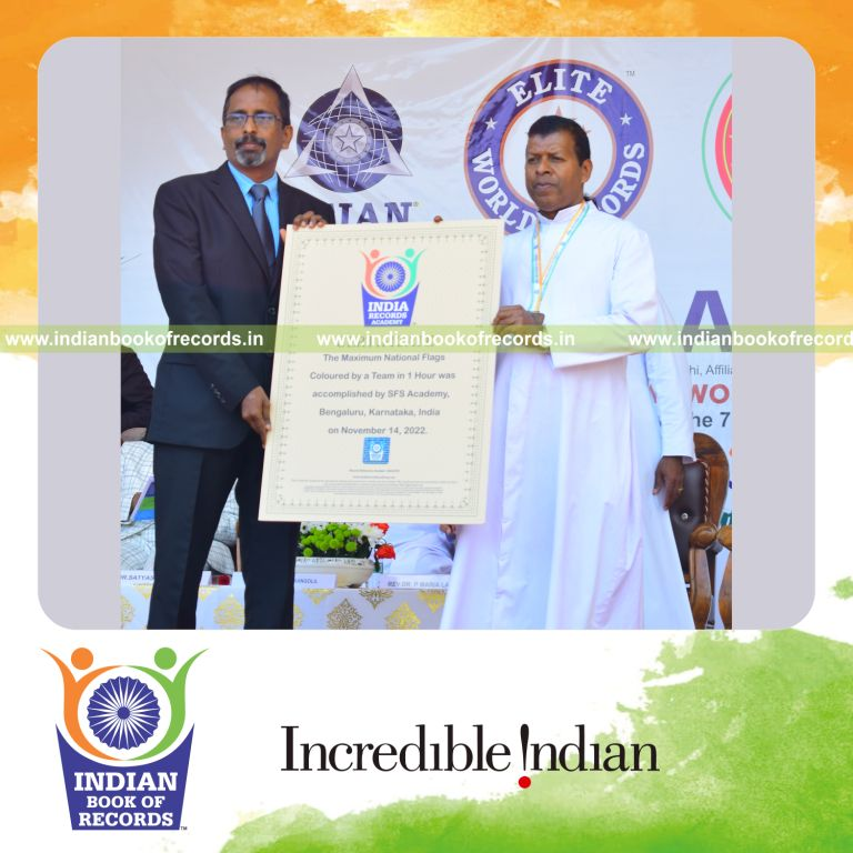 Group working together to color numerous national flags quickly for Indian Book of Records