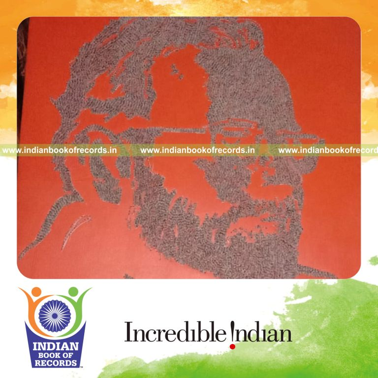 Large artwork created using rice grains inscribed with the word Ram recognized by Indian Book of Records