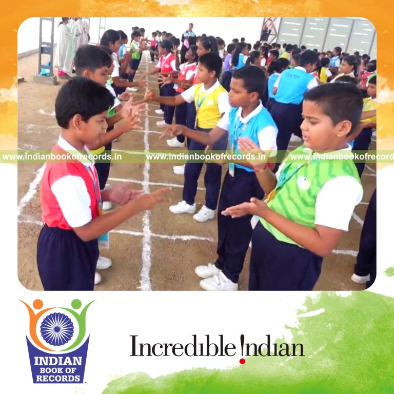 Large group playing rock paper scissors simultaneously at a single venue for Indian Book of Records