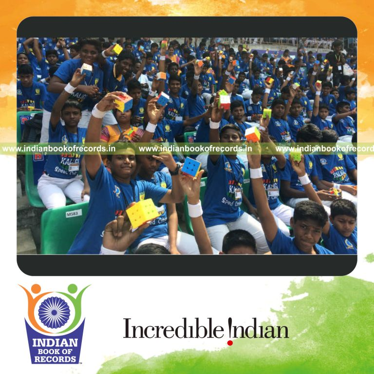 participants solving rubiks cubes simultaneously during a coordinated record attempt for Indian Book of Records