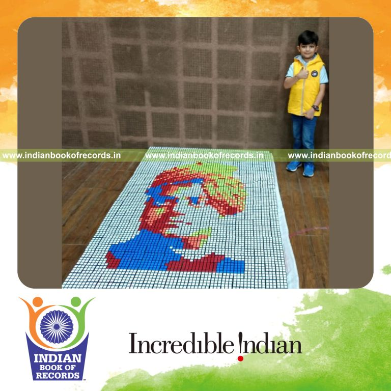 Young boy creating multiple portraits using Rubik’s cubes recognized by Indian Book of Records