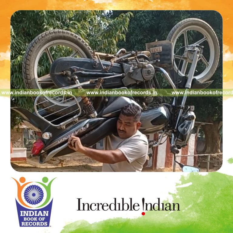 Individual running a long distance while carrying a motorbike on the shoulder recognized by Indian Book of Records