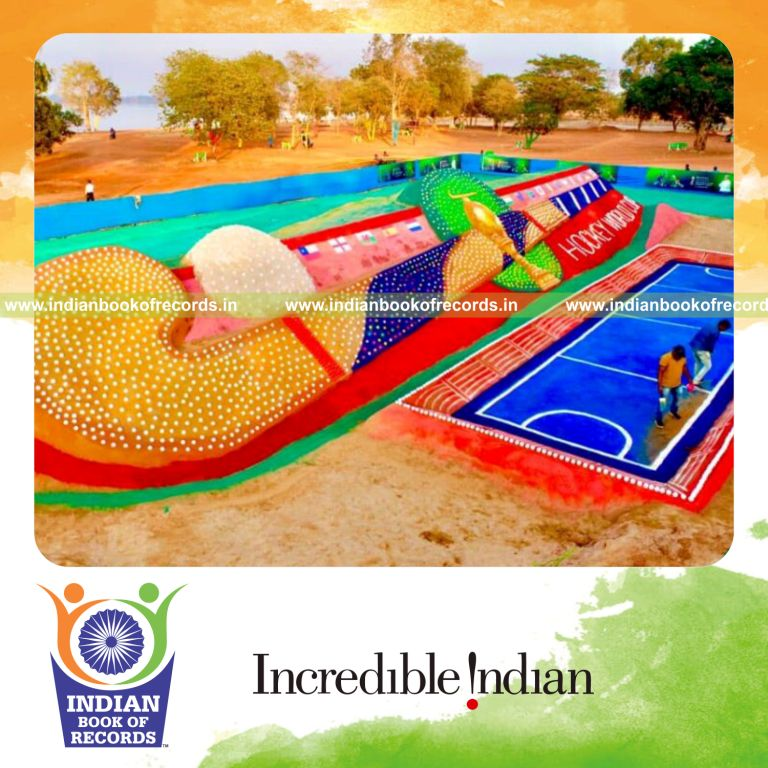 Large hockey stick installation crafted using sand recognized by Indian Book of Records