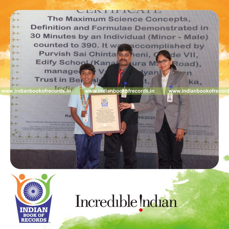Young boy demonstrating science concepts and formulas quickly in a timed session recognized by Indian Book of Records