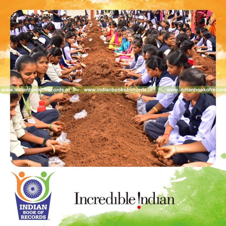 Numerous participants creating seed balls together within four hours at a single venue for the Indian Book of Records