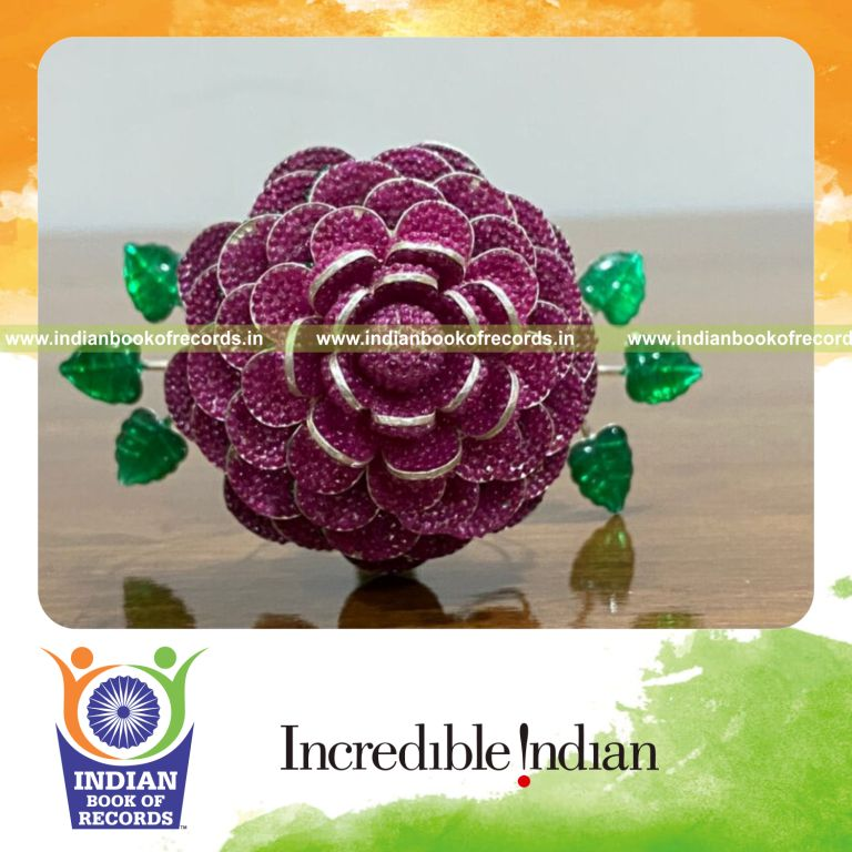 Decorative silver flower intricately embedded with numerous artificial pearls recognized by Indian Book of Records