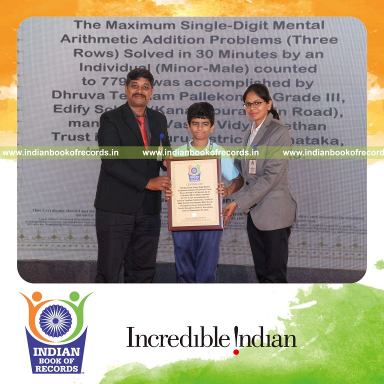 Young boy solving single-digit addition problems across rows in a timed session recognized by Indian Book of Records