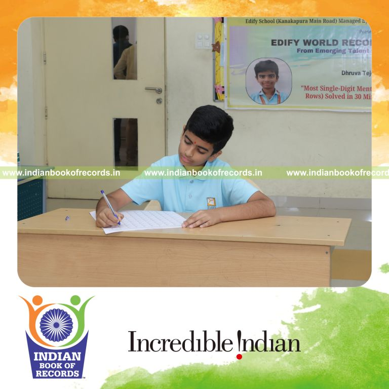 Young boy solving single-digit addition problems in rows within a timed session recognized by Indian Book of Records