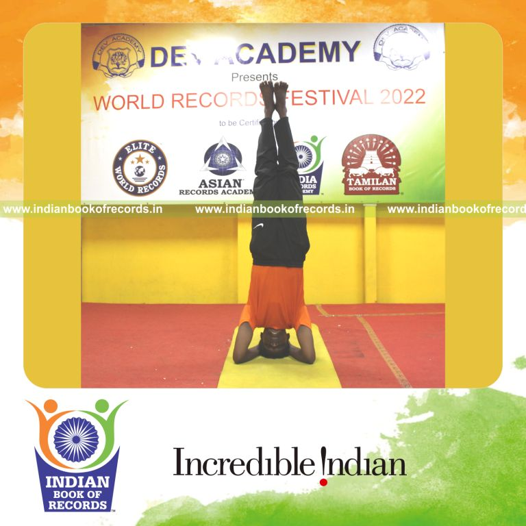 An individual holding the Sirasasana headstand pose for an extended time for the Indian Book of Records