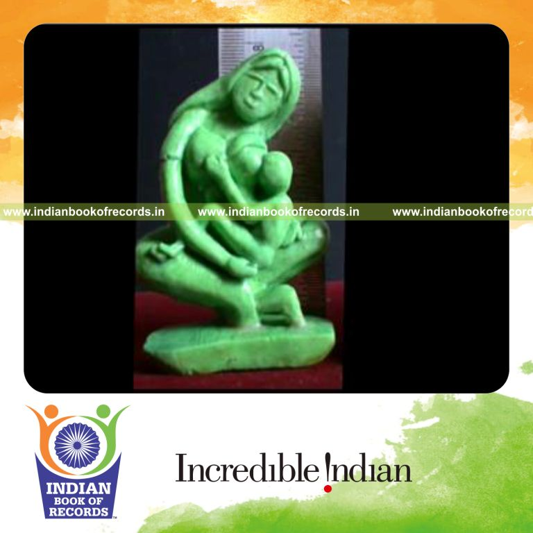tiny breastfeeding mother sculpture carved from soap for record in Indian Book of Records