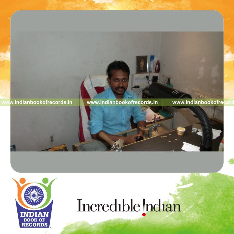 male individual creating smallest drilling machine for record in Indian Book of Records