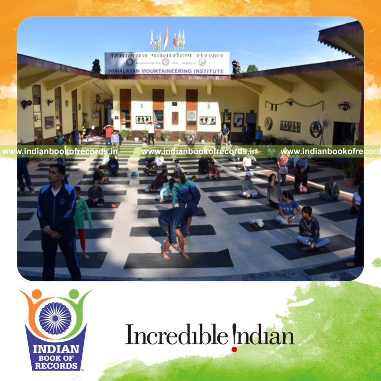 Team performing continuous Surya Namaskar in a relay format for an extended duration recognized by Indian Book of Records