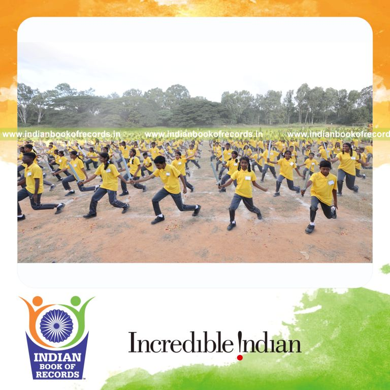 Large group performing a synchronized sword dance at a single venue recognized by Indian Book of Records