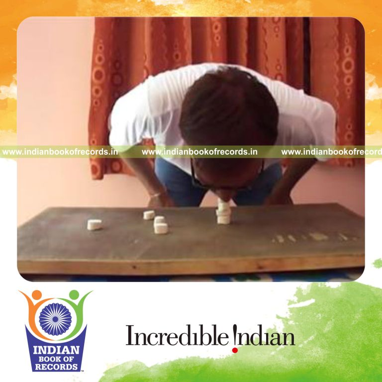 individual stacking marshmallow tower using mouth for record in Indian Book of Records