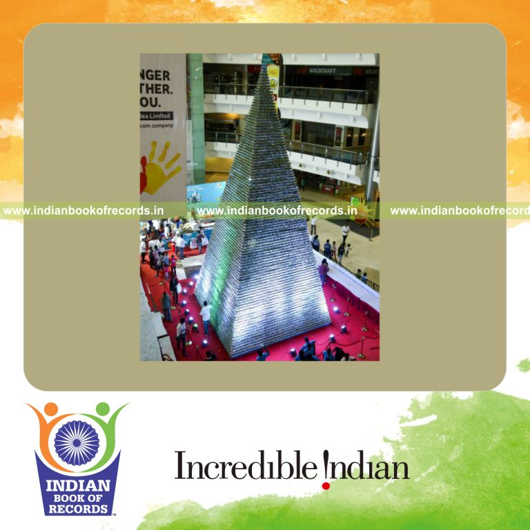 a tall structure made by stacking cupcakes vertically in a stable arrangement for a record in Indian Book of Records