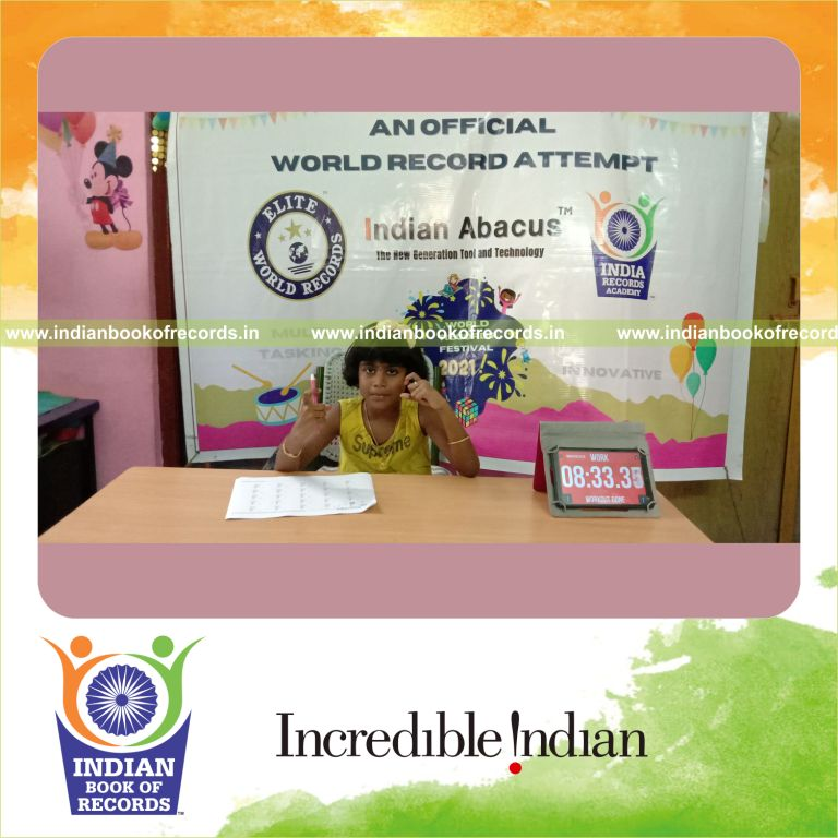 A participant solving multiple two-digit addition problems across two rows within ten minutes for the Indian Book of Records