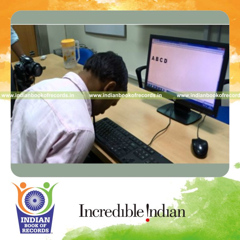 individual typing the alphabet using a mouth stick in fastest time for Indian Book of Records