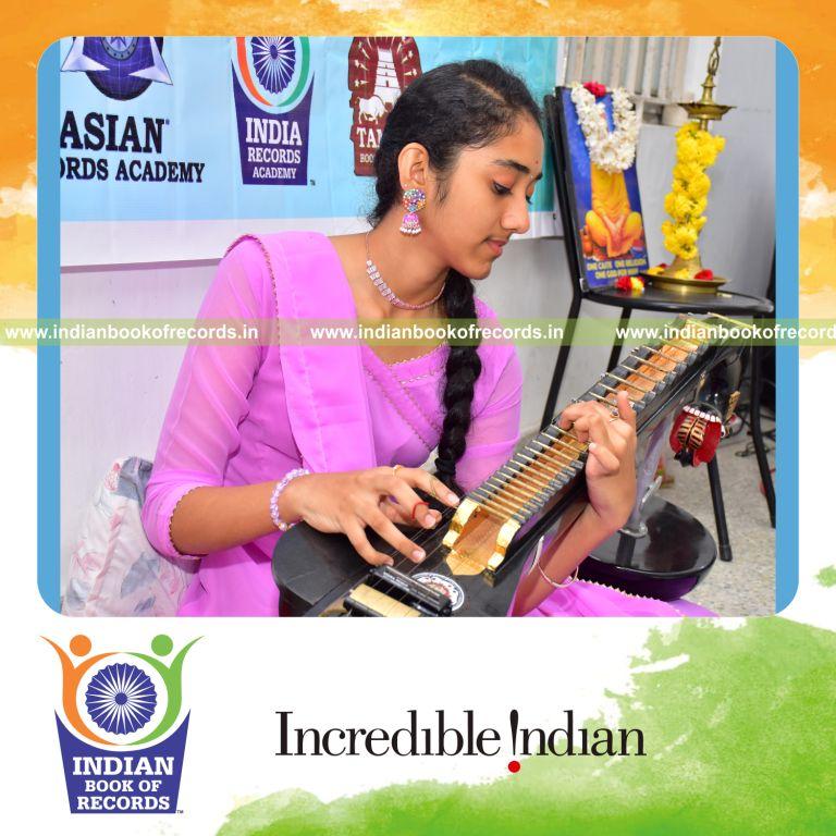 A young female musician performing an extended veena concert recorded by the Indian Book of Records