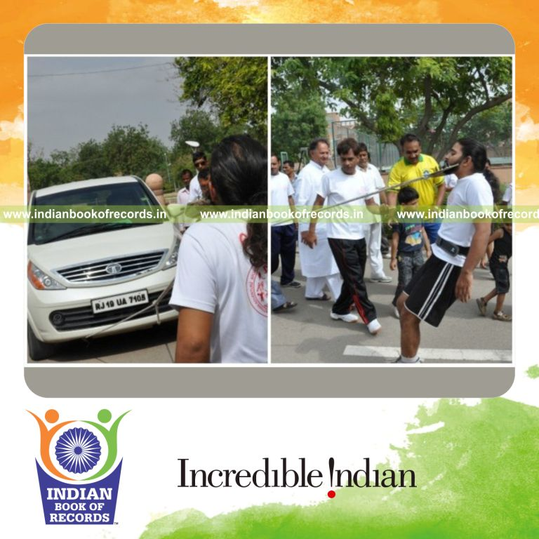 individual pulling heavy vehicle using beard for Indian Book of Records