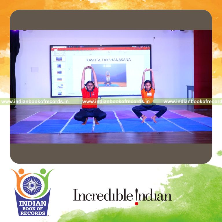 Team performing yoga in a continuous relay format over an extended period for the Indian Book of Records