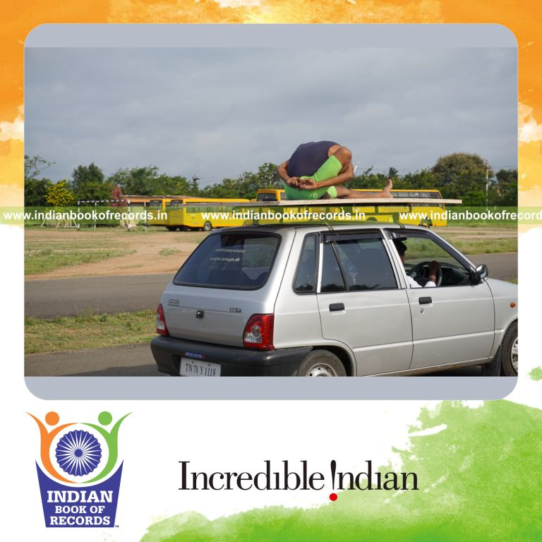an individual performing yogasanas blindfolded on a moving car within ten minutes for a record in Indian Book of Records