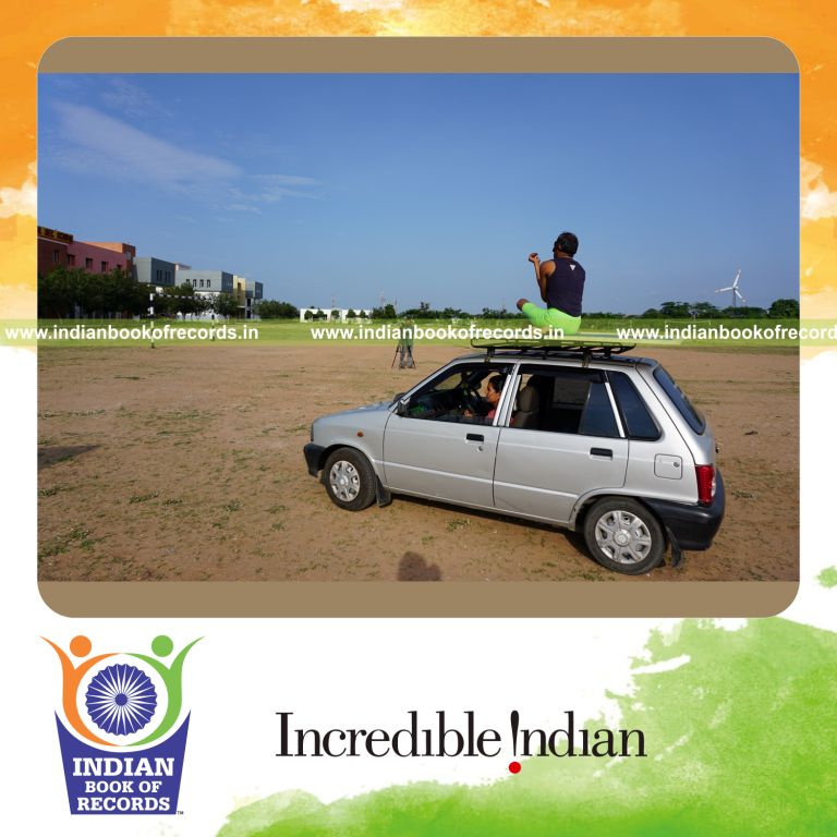 an individual performing yogasanas blindfolded on a moving car within five minutes for a record in Indian Book of Records