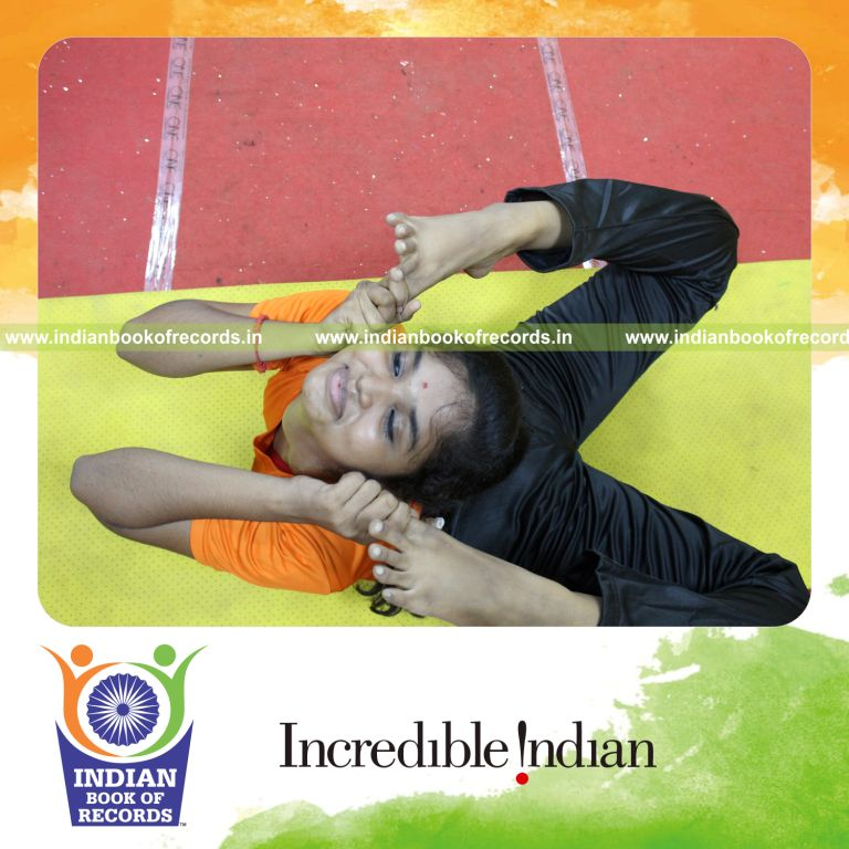 A young participant performing numerous yoga poses within ten minutes for the Indian Book of Records