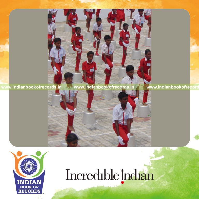 participants performing yogasanas on inverted vessels for Indian Book of Records