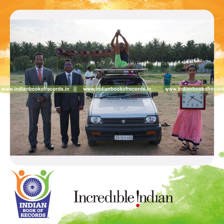 an individual performing multiple yogasanas on a moving car within five minutes for a record in Indian Book of Records
