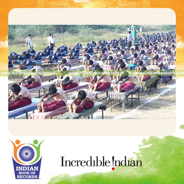 participants performing yogasanas on desk tables simultaneously for Indian Book of Records