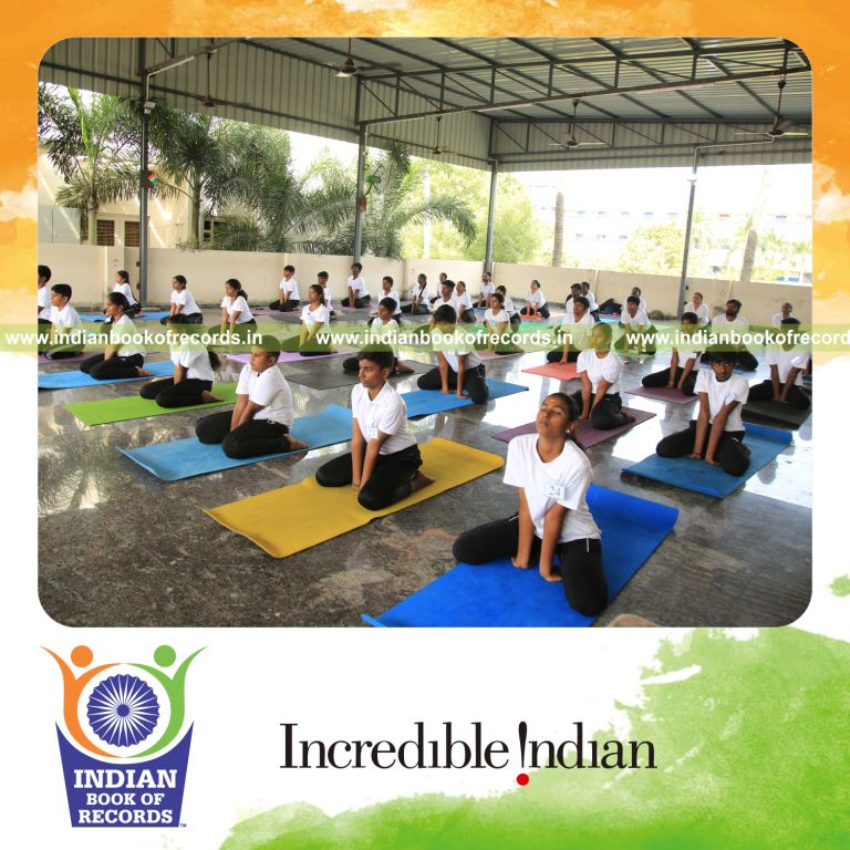 Team performing multiple yogasanas together within a short duration for the Indian Book of Records