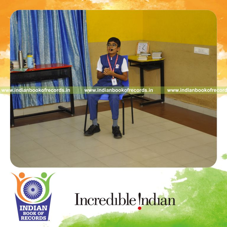 A young participant completing an extended book review marathon recognized by the Indian Book of Records