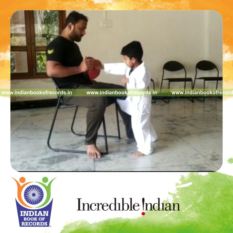 Toddler performing rapid boxing punches in a record attempt recognized by Indian Book of Records